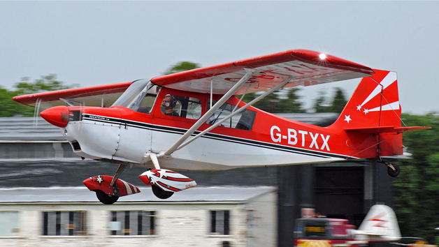 30-Minute Flying Lesson with Free Passenger Ride and Glass of Fizz for Two