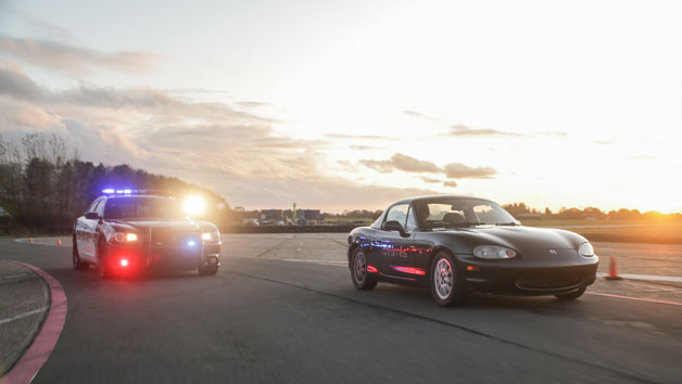 Immersive Police Pursuit Driving Experience in a Mazda MX5 Image 3