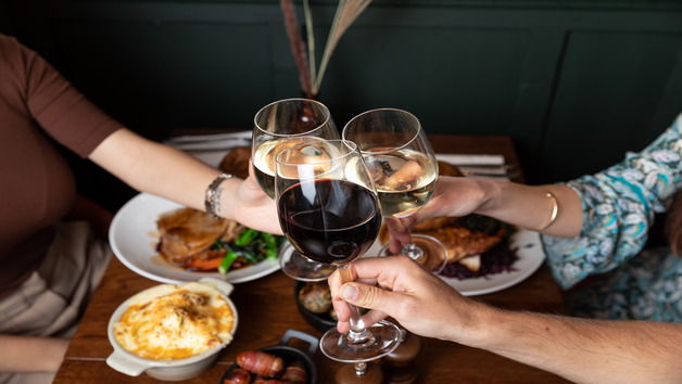 Sunday Roast Sharer with a Glass of Wine at a British Pub or Bar for Four Image 2