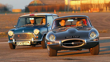 Click to view details and reviews for E Type Jaguar Versus Classic Mini Cooper S Driving.