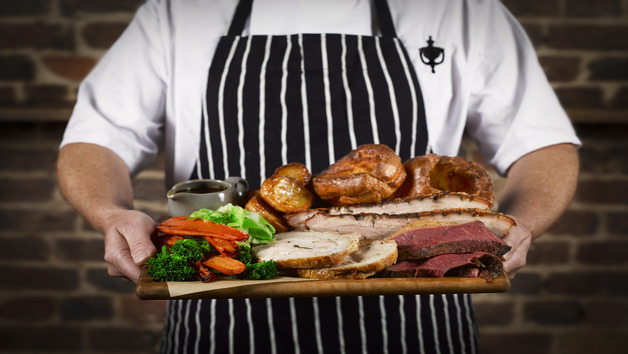 Sunday Roast Sharer with a Glass of Wine at a British Pub or Bar for Four Image 1