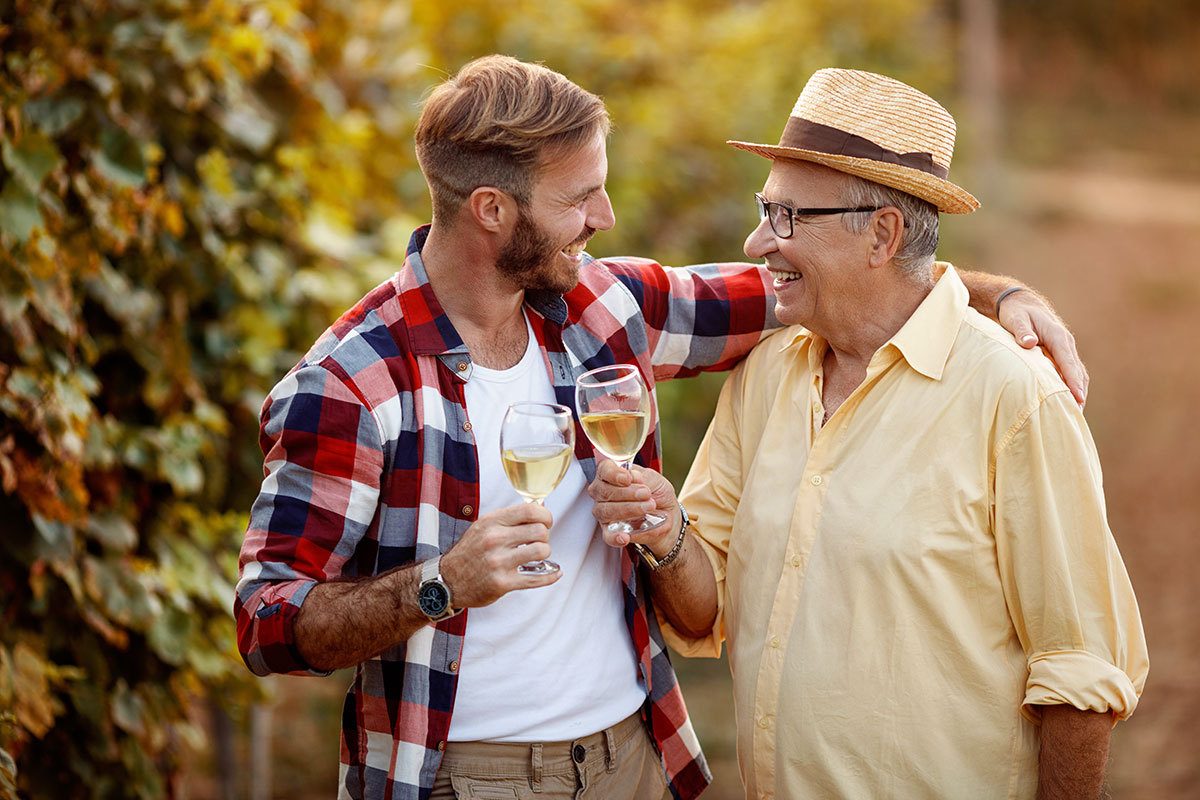 Father and son with wine glasses at a wine tasting experience